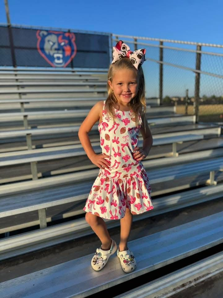 Pink bows and footballs